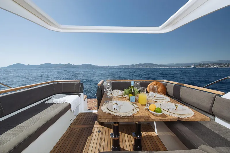 Slide: The Image of Manufacturer Provided Image: Luxury dining setup on 2025 Marex 390 yacht with ocean view. - 6