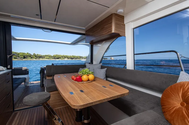 Slide: The Image of Manufacturer Provided Image: Luxurious interior of 2025 Marex 390 yacht with ocean view and elegant dining area. - 7