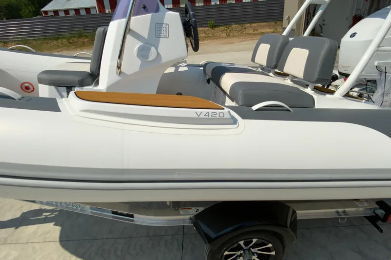 Slide: The Image of 2027 Gala V420 boat with sleek design and comfortable seating on a trailer. - 4