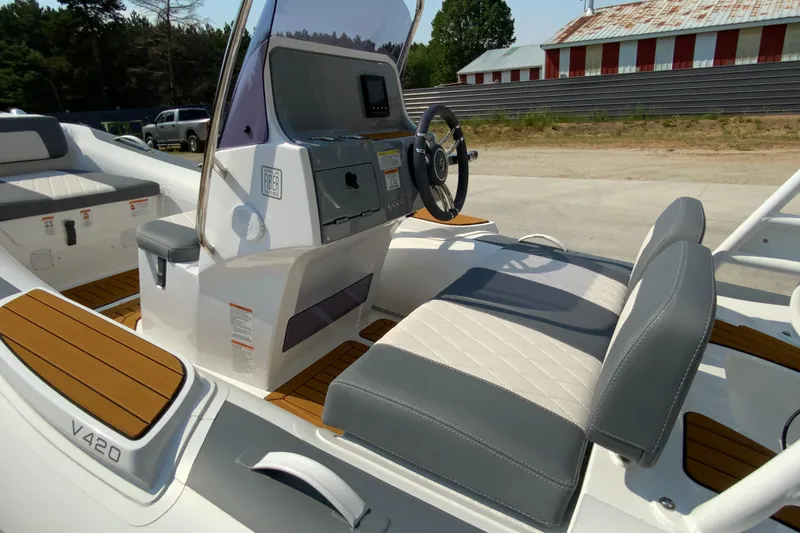 Slide: The Image of 2027 Gala V420 boat interior with modern steering console and cushioned seating. - 7