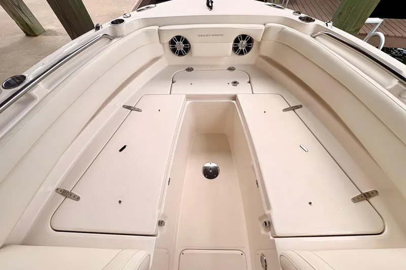 Slide: The Image of 2022 Grady-White Freedom 235 boat interior with spacious seating and storage compartments. - 14