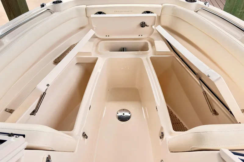 Slide: The Image of 2022 Grady-White Freedom 235 boat interior with open storage compartments. - 15