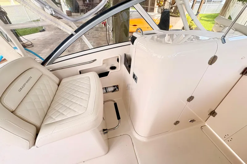Slide: The Image of Interior of 2022 Grady-White Freedom 235 boat with luxurious seating and modern design. - 18