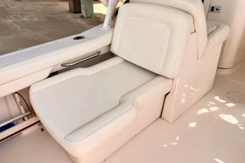Slide: The Image of 2022 Grady-White Freedom 235 boat seat with white upholstery and sleek design. - 7