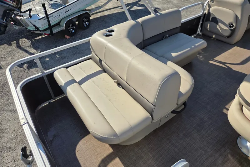 Slide: The Image of 2022 Sun Tracker Party Barge 18 DLX interior seating with beige upholstery. - 11
