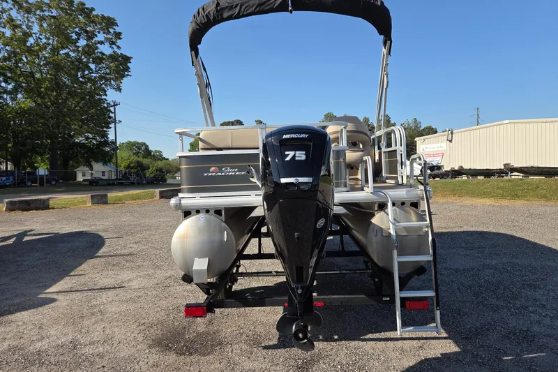 Slide: The Image of 2022 Sun Tracker Party Barge 18 DLX with Mercury 75 engine, parked outdoors. - 5