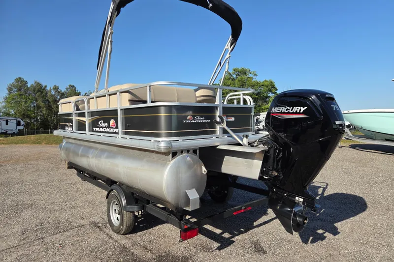 Slide: The Image of 2022 Sun Tracker Party Barge 18 DLX pontoon boat with Mercury engine on trailer. - 6