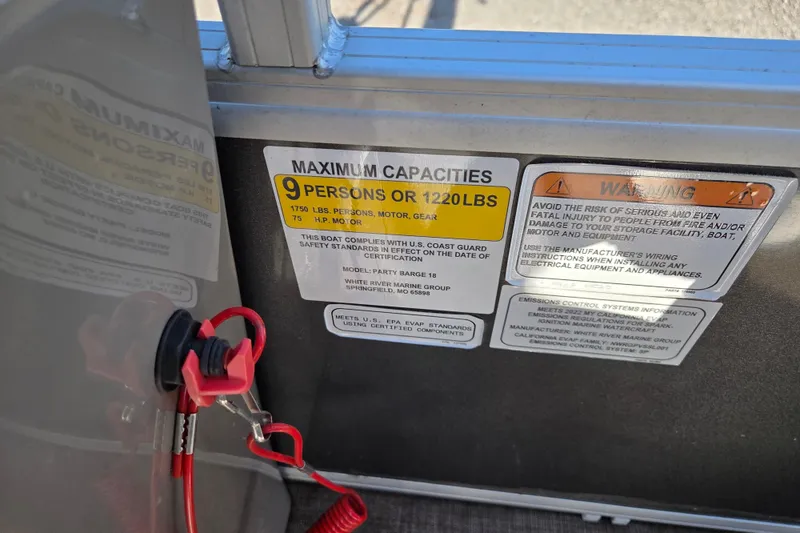 Slide: The Image of 2022 Sun Tracker Party Barge 18 DLX capacity label, showing limits and safety warnings. - 7