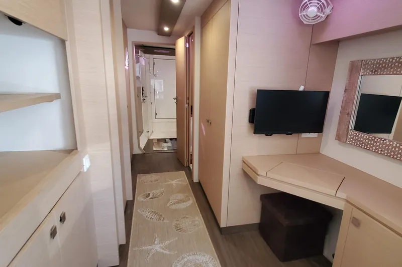 Slide: The Image of Interior of 2018 Fountaine Pajot Helia 44 Evolution catamaran with modern decor and compact workspace. - 8