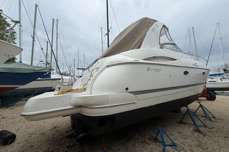 Slide: The Image of Helm of 2007 Cruisers Yachts 370 Express with steering wheel and navigation controls. - 12