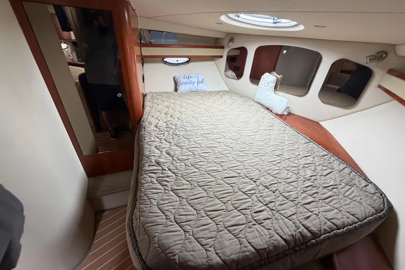 Slide: The Image of Interior cabin of 2007 Cruisers Yachts 370 Express with cozy bed and decor. - 21