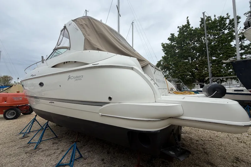 Slide: The Image of 2007 Cruisers Yachts 370 Express on stands, side view, outdoors. - 32