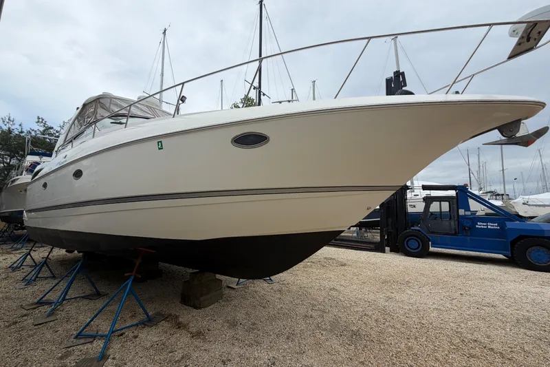 Slide: The Image of 2007 Cruisers Yachts 370 Express interior with sink, storage, and emergency kit. - 9