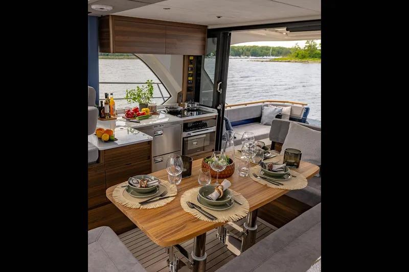 Slide: The Image of Manufacturer Provided Image: Luxurious interior of 2025 Marex 440 Scandinavia yacht with elegant dining setup. - 10