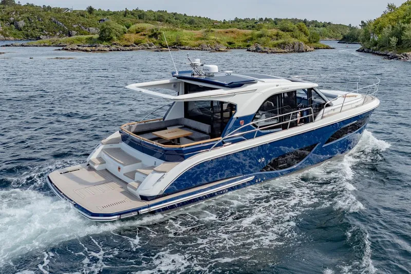 Slide: The Image of Manufacturer Provided Image: 2025 Marex 440 Scandinavia yacht cruising in scenic waters, showcasing sleek design and luxury features. - 2