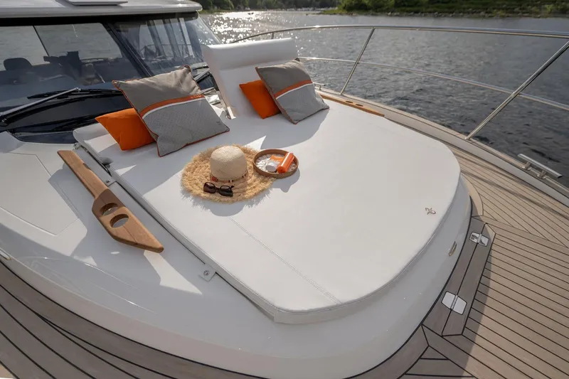 Slide: The Image of Manufacturer Provided Image: Luxurious 2025 Marex 440 Scandinavia yacht deck with sunbathing area and cushions. - 5