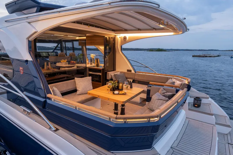 Slide: The Image of Manufacturer Provided Image: Luxurious 2025 Marex 440 Scandinavia yacht with elegant outdoor seating and scenic ocean view. - 7