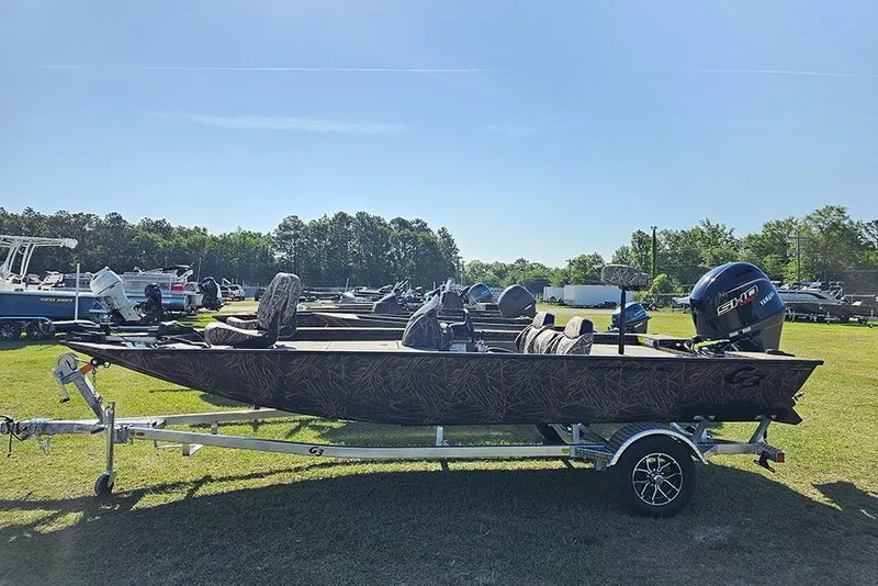 The Image of 2026 G3 Sportsman 1810 boat on trailer, parked outdoors under clear sky. - 1