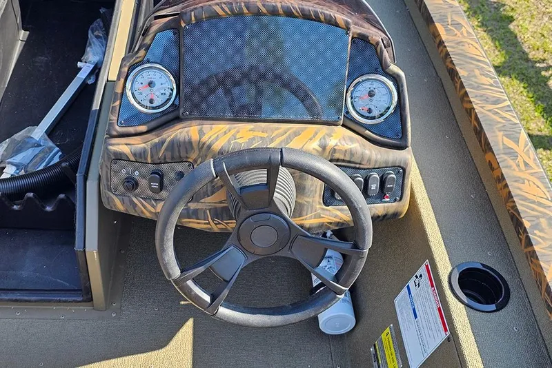 Slide: The Image of Steering console of 2026 G3 Sportsman 1810 boat with gauges and controls. - 17