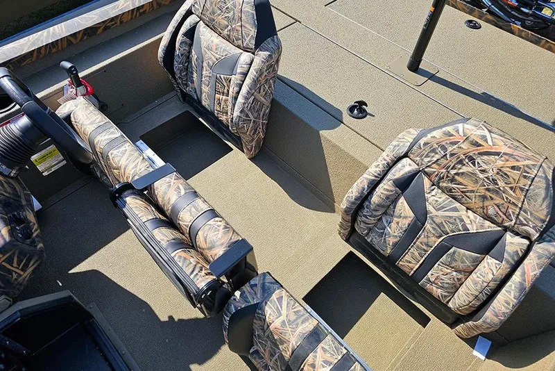 Slide: The Image of 2026 G3 Sportsman 1810 boat interior with camouflage seating and steering wheel. - 19