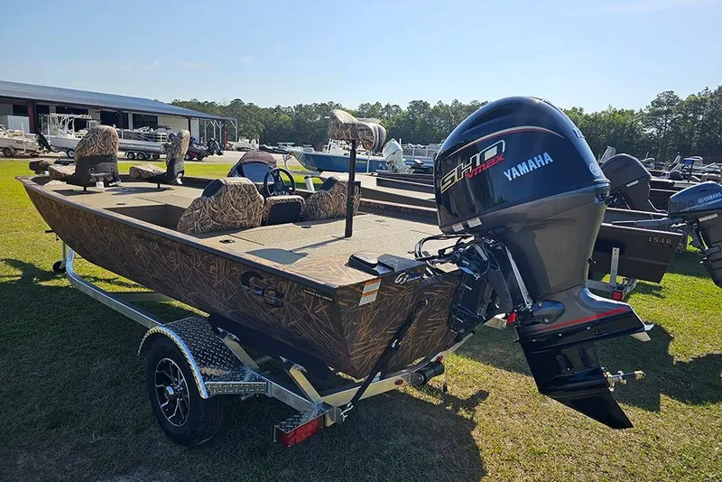 Slide: The Image of 2026 G3 Sportsman 1810 boat with Yamaha engine on a trailer, parked outdoors. - 3