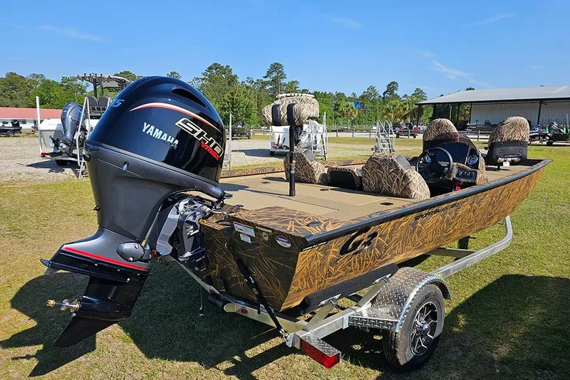Slide: The Image of 2026 G3 Sportsman 1810 boat with Yamaha engine on a trailer, outdoors. - 6