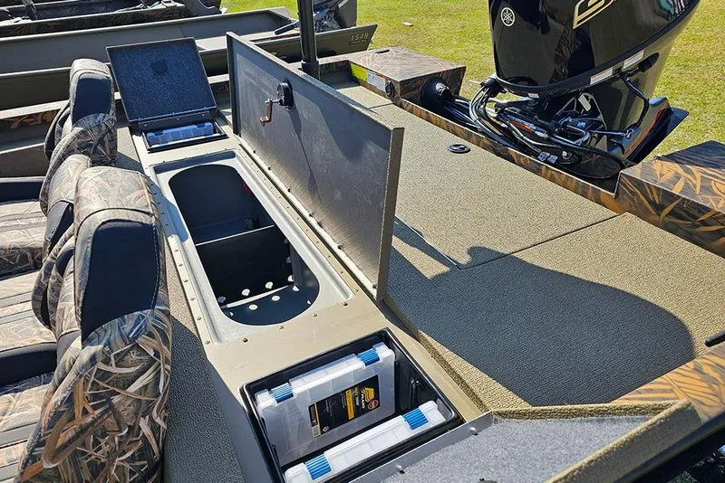 Slide: The Image of 2026 G3 Sportsman 1810 boat interior with camo seats and storage compartments open. - 9