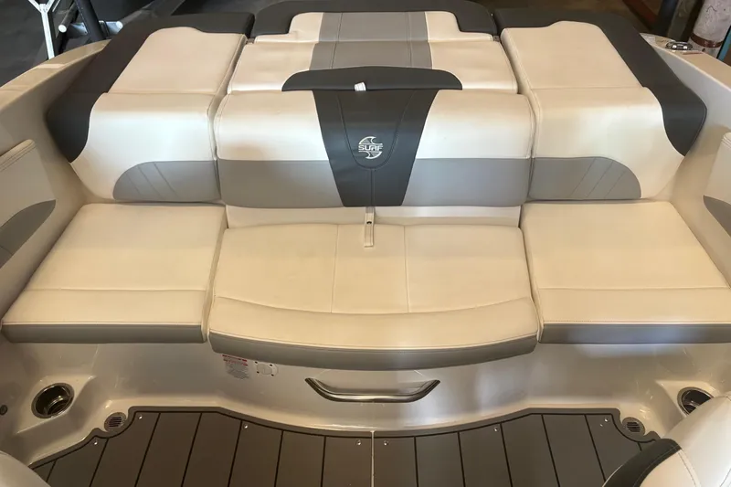 Slide: The Image of 2022 Chaparral 21 Surf boat interior with cushioned seating and stylish design. - 3