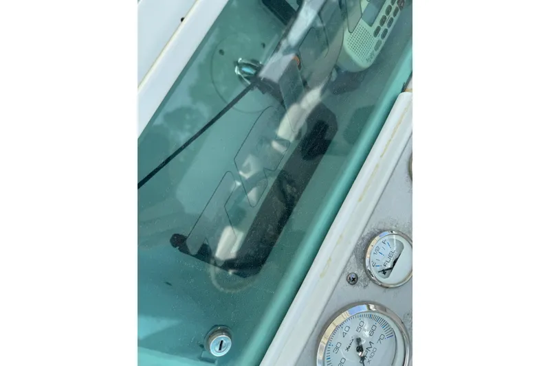 Slide: The Image of Dashboard of a 2007 Triumph 215 TE boat with gauges and controls. - 14