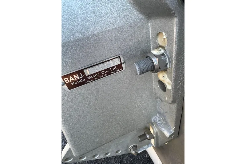 Slide: The Image of Close-up of a Triumph 215 TE 2007 engine part with Honda label. - 16