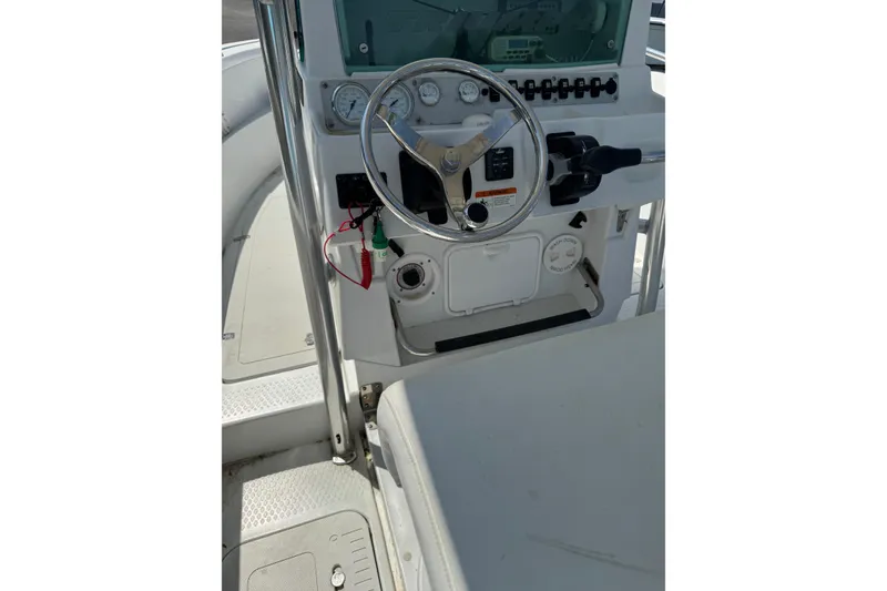 Slide: The Image of 2007 Triumph 215 TE boat console with steering wheel and control panel. - 3