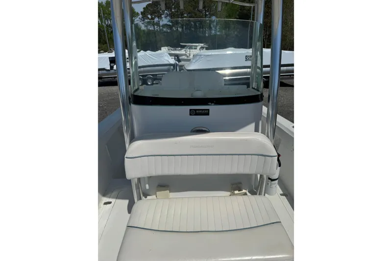 Slide: The Image of 2007 Triumph 215 TE boat interior with white seating and windshield. - 8