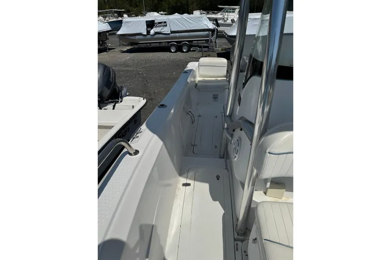 Slide: The Image of 2007 Triumph 215 TE boat interior with seating and stainless steel railings. - 9