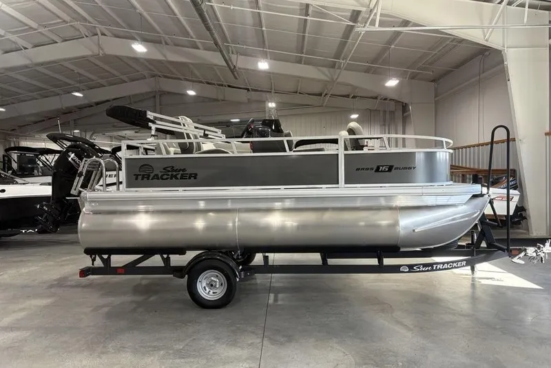 The Image of 2026 Sun Tracker Bass Buggy 16 XL Select pontoon boat in showroom. - 1