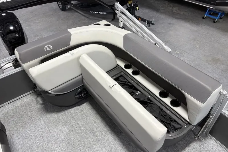 Slide: The Image of 2026 Sun Tracker Bass Buggy 16 XL Select boat seating with storage and cup holders. - 14