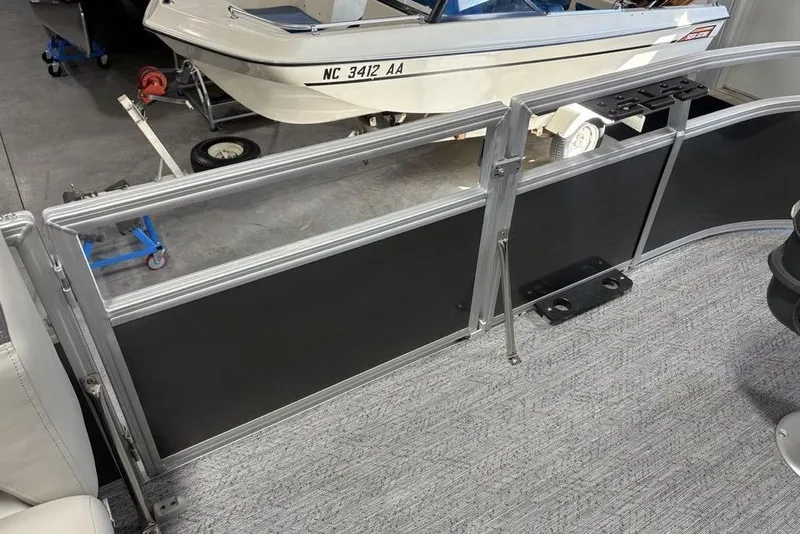 Slide: The Image of 2026 Sun Tracker Bass Buggy 16 XL Select pontoon boat interior with railing detail. - 6