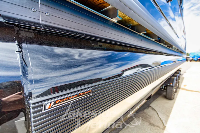 Slide: The Image of Close-up of 2026 Godfrey Sanpan 2700 ULW Twin pontoon boat with reflective finish. - 10