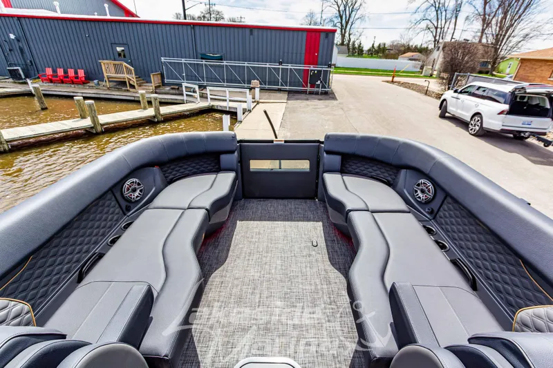 Slide: The Image of Luxurious 2026 Godfrey Sanpan 2700 ULW Twin pontoon boat with spacious seating and modern design. - 16