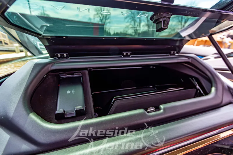 Slide: The Image of Open storage compartment in 2026 Godfrey Sanpan 2700 ULW Twin boat with wireless charging pad. - 38
