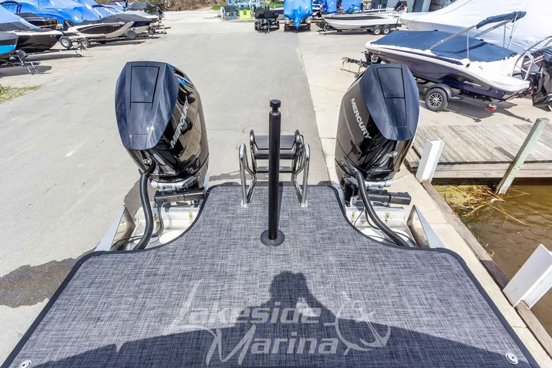 Slide: The Image of 2026 Godfrey Sanpan 2700 ULW Twin with dual Mercury outboard engines at marina. - 52