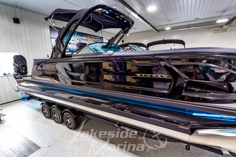 Slide: The Image of 2026 Godfrey Sanpan 2700 ULW Twin pontoon boat displayed indoors at Lakeside Marina. - 54