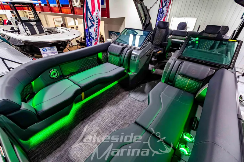 Slide: The Image of Luxurious interior of 2026 Godfrey Sanpan 2700 ULW Twin pontoon boat with green LED lighting. - 57
