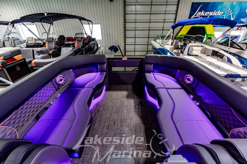 Slide: The Image of Luxurious interior of 2026 Godfrey Sanpan 2700 ULW Twin pontoon boat with purple LED lighting. - 58
