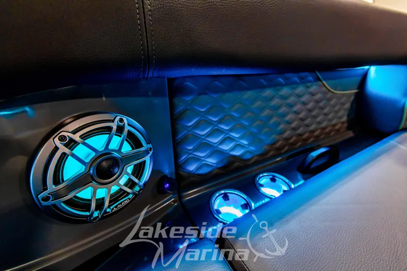 Slide: The Image of Interior of 2026 Godfrey Sanpan 2700 ULW Twin with illuminated speaker and cup holders. - 63