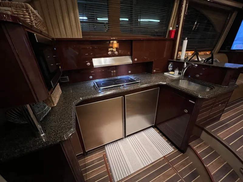 Slide: The Image of Luxurious kitchen on a 2007 Sea Ray 52 Sedan Bridge yacht. - 13