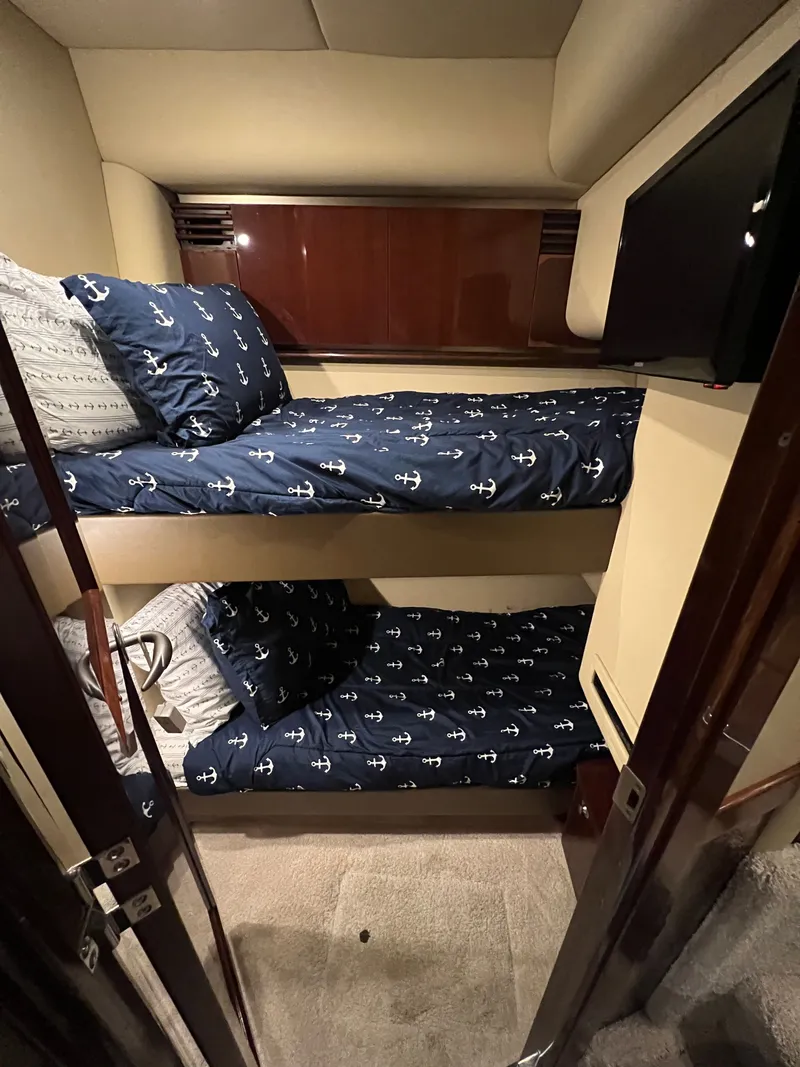 Slide: The Image of Interior of 2007 Sea Ray 52 Sedan Bridge with bunk beds. - 17