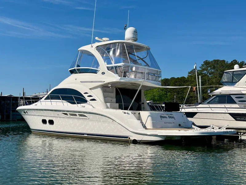 Slide: The Image of 2007 Sea Ray 52 Sedan Bridge yacht docked in harbor. - 2