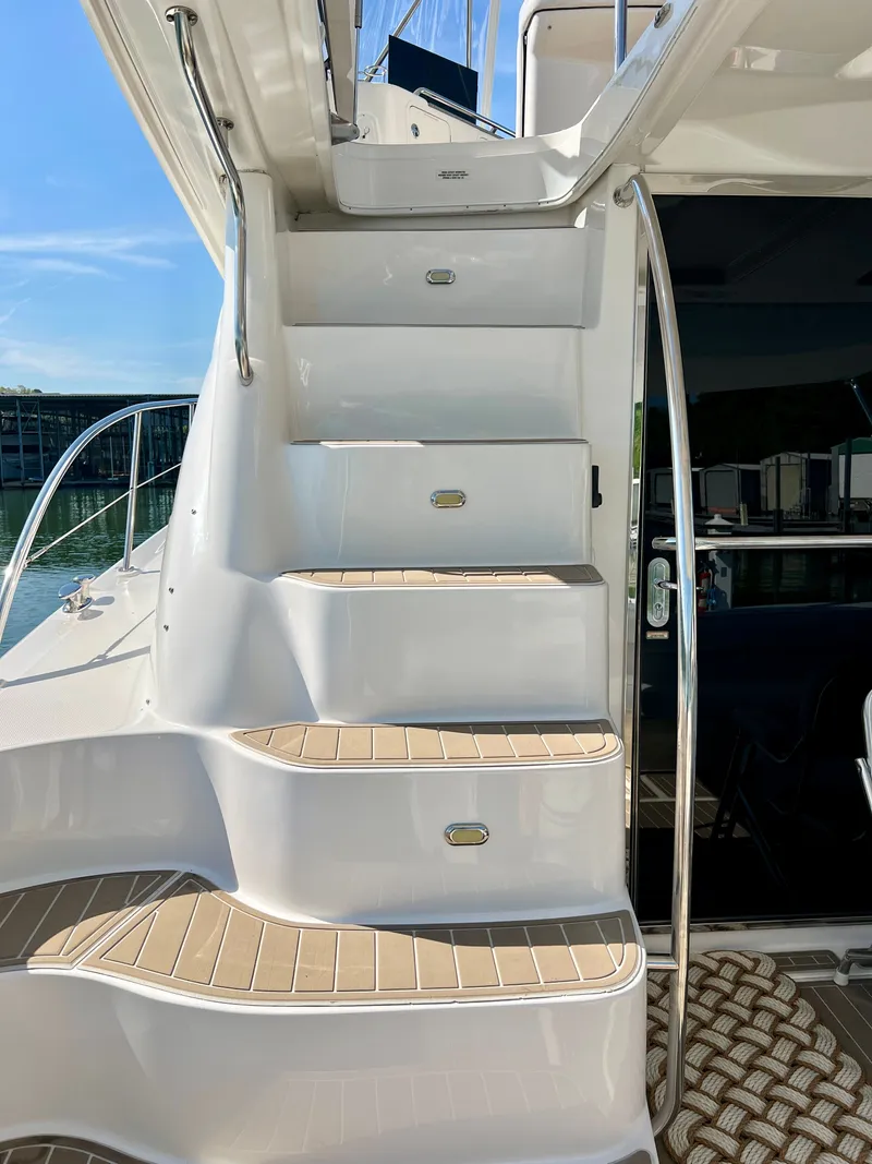 Slide: The Image of Staircase on a 2007 Sea Ray 52 Sedan Bridge yacht. - 25
