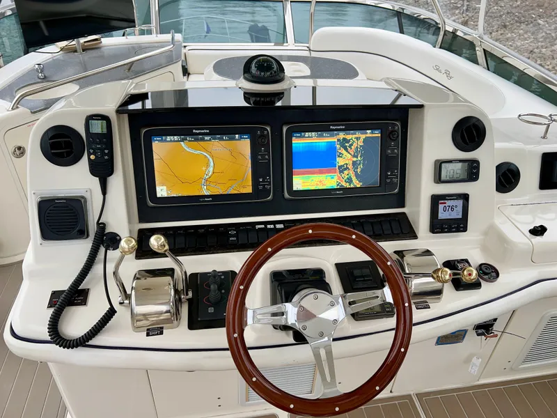 Slide: The Image of 2007 Sea Ray 52 Sedan Bridge helm with navigation system. - 27