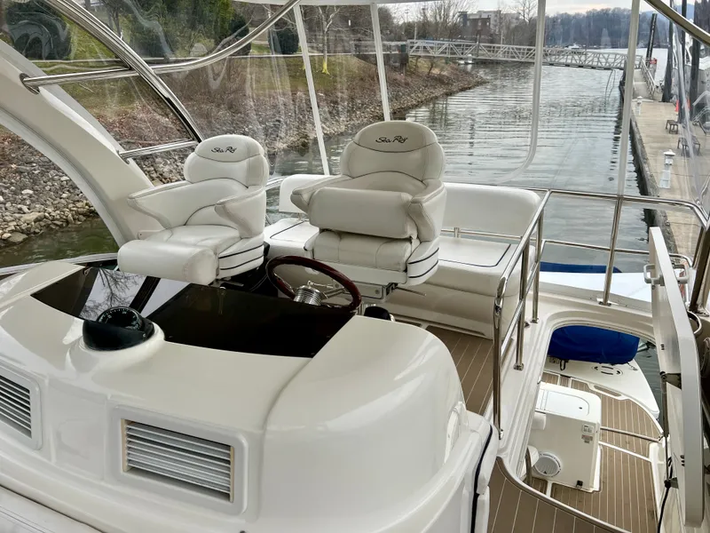 Slide: The Image of 2007 Sea Ray 52 Sedan Bridge cockpit with luxurious seating. - 29